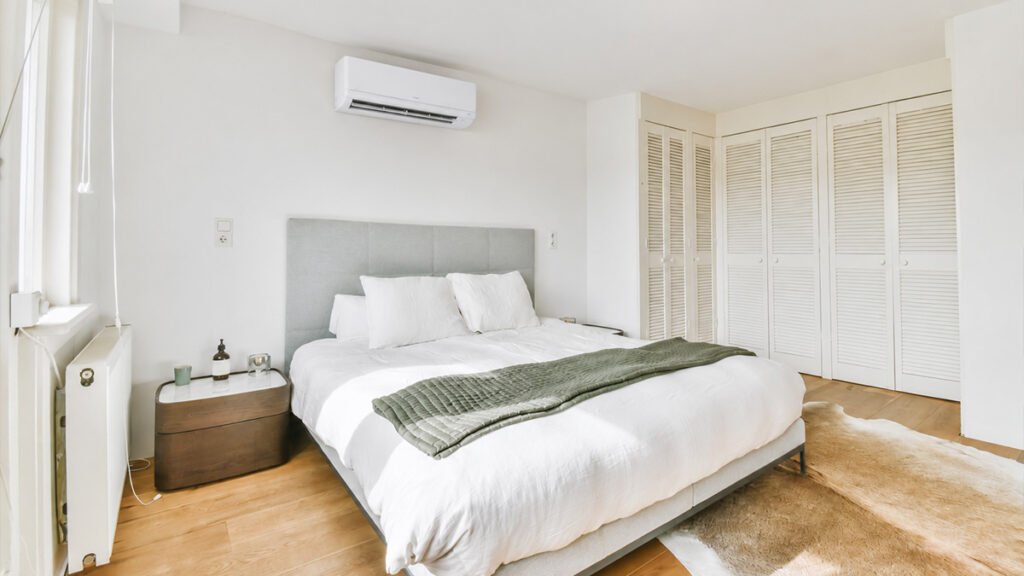 Bedroom with a wall-mounted ductless mini-split system